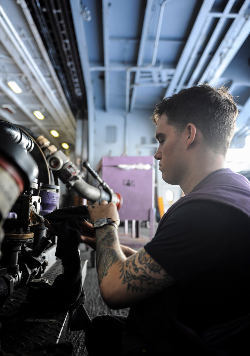 Purple shirts handle refueling of all aircraft... I’m shwoing my age but it’s still odd to me to see how many service members have massive visible tattoos...